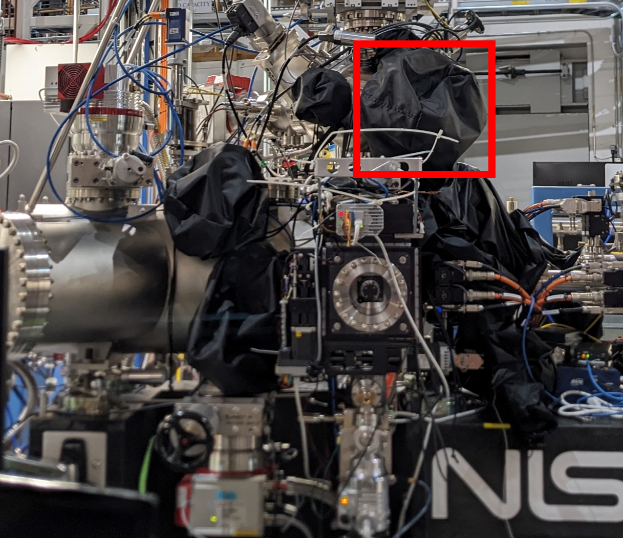 Outboard view of RSoXS chamber. Red box: blackout cover for solid sample load lock.